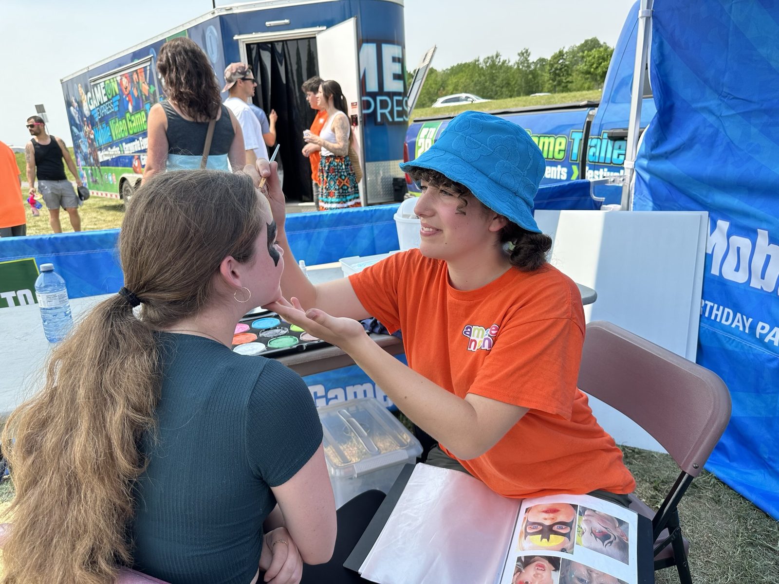 Face painting setup at an outdoor community event